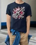 Elegant Guitar with Flowers Tee - model wearing Navy T-shirt, hands in pockets, denim shirt at waist