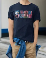 Eagle Fireworks One Nation Under God T-Shirt - model wearing Navy T-shirt, hands in pockets, denim shirt at waist