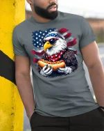 Patriotic Eagle Hot Dog T-Shirt - model leaning on yellow-black pole, wearing Gray T-shirt, hand in pocket