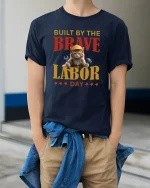 Built By The Brave Labor Day Cat T-Shirt - model wearing Navy T-shirt, hands in pockets, denim shirt at waist