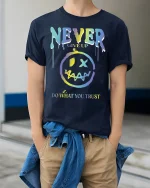 Never Give Up Motivational Graphic Tee - model wearing Navy T-shirt, hands in pockets, denim shirt at waist