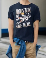 Houston We Have Tacos Tee - model wearing Navy T-shirt, hands in pockets, denim shirt at waist