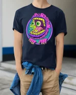 Trippy Monster Face Graphic Tee - model wearing Navy T-shirt, hands in pockets, denim shirt at waist