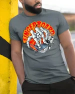 Fingerboard Skeleton Skate Tee - model leaning on yellow-black pole, wearing Gray T-shirt, hand in pocket
