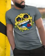 Creepy Skull Spider Tongue Tee - model leaning on yellow-black pole, wearing Gray T-shirt, hand in pocket