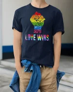 Love Wins Rainbow T-Shirt - model wearing Navy T-shirt, hands in pockets, denim shirt at waist