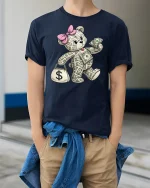 Funny Money Teddy Bear Tee - model wearing Navy T-shirt, hands in pockets, denim shirt at waist