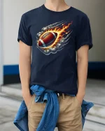 Flaming Football T-Shirt for Sports and Game Lovers - model wearing navy tee with hands in pockets