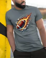 Flaming Football T-Shirt for Sports and Game Lovers - model wearing grey tee, leaning on column