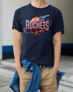 Retro Rocket Planet Blast Graphic Tee for Space Fans - model wearing navy tee with hands in pockets