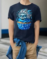 Blue Skull Cupcake Horror Art Funny Graphic Tee - model wearing navy tee with hands in pockets