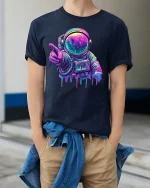 Neon Astronaut T-Shirt Cosmic Space Art Streetwear - model wearing navy tee with hands in pockets