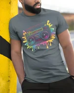 Retro Boombox T-Shirt Neon 80s Music Lover Streetwear - model wearing grey tee, leaning on column