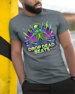 Drop Dead Beats DJ Skeleton T-Shirt EDM Party Style - model wearing grey tee, leaning on column