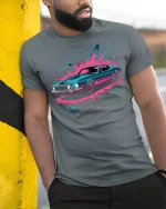 Retro Muscle Car T-Shirt Neon Splash Streetwear Style - model wearing grey tee, leaning on column