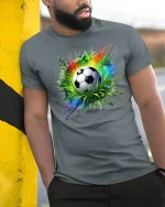 Soccer Explosion T-Shirt Colorful Energy Game Tee - model wearing grey tee, leaning on column