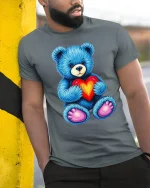 Cute Blue Teddy Bear Holding Heart T-Shirt - model leaning on yellow-black pole, wearing Gray T-shirt, hand in pocket