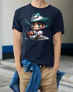 Cute Cowboy Football Player Cartoon Graphic Tee - model wearing navy tee with hands in pockets