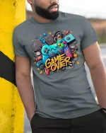 Game Over T-Shirt - Retro Gamer Controller Graphic Tee - model wearing grey tee, leaning on column