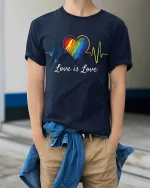 Love Is Love Rainbow Heartbeat Equality Pride T-Shirt - model wearing navy tee with hands in pockets