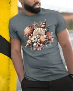 Vintage Seashell Bouquet Art Tee with Ocean Pearl Accents - model wearing grey tee, leaning on column