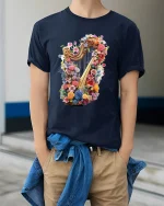 Floral Harp Magic Tee - Colorful Harp T-Shirt for Music Lovers - model wearing navy tee with hands in pockets