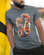Floral Harp Magic Tee - Colorful Harp T-Shirt for Music Lovers - model wearing grey tee, leaning on column