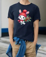Cute Christmas Bunny Tee with Holiday Berries and Cozy Hat - model wearing navy tee with hands in pockets