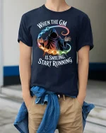 When the GM Is Smiling Funny RPG Gamer Tee - model wearing navy tee with hands in pockets