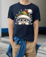Cute Christmas Kitty Lights Tee With Cozy Holiday Magic - model wearing navy tee with hands in pockets