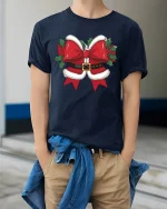 Funny Christmas Bow Graphic Tee With Santa Belt Style Design - model wearing navy tee with hands in pockets