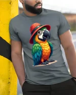 Funny Parrot Hat Art Tee With Colorful Tropical Personality - model wearing grey tee, leaning on column