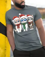 Cute Christmas Kittens Art Tee With Festive Holiday Smiles - model wearing grey tee, leaning on column