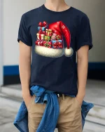 Christmas Santa Hat Gift Stack Tee With Festive Holiday Cheer - model wearing navy tee with hands in pockets
