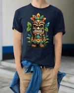 Funny Tiki Warrior Art Graphic Tee With Colorful Island Style - model wearing navy tee with hands in pockets