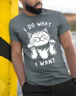 Funny Cat Attitude Graphic Tee With Cute I Do What I Want Design - model wearing grey tee, leaning on column