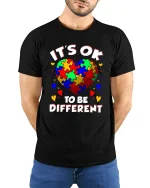 Its Ok To Be Different Colorful Puzzle Heart Graphic Tee - model wearing black tee with hands behind back
