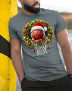 Christmas Basketball Hoop Santa Hat Holiday Sports Graphic Tee - model wearing grey tee, leaning on column
