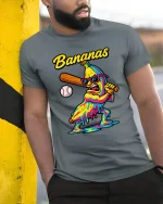 Bananas Baseball Slugger Melting Art Graphic Tee Funny Sports Vibe - model wearing grey tee, leaning on column