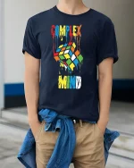 Complex Mind Melting Puzzle Cube Art Tee Creative Graphic Shirt - model wearing navy tee with hands in pockets