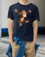 Funny Crazy Monkey Tee with Big Smile Cartoon Design - model wearing navy tee with hands in pockets