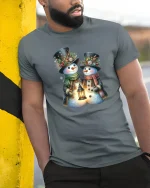 Snowman Couple Lantern Glow Tee with Festive Winter Design - model wearing grey tee, leaning on column