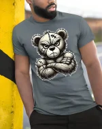 Angry Tough Teddy Bear Tee with Bold Cartoon Stitch Art - model wearing grey tee, leaning on column