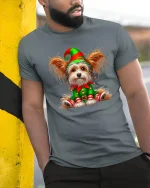 Cute Christmas Elf Dog Tee with Festive Holiday Puppy Art - model wearing grey tee, leaning on column