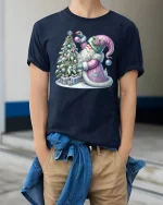 Pastel Christmas Santa Decorating Tree Winter Magic Graphic Tee - model wearing navy tee with hands in pockets
