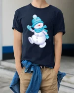 Cute Snowman Winter Tee with Cozy Blue Hat and Scarf Artwork - model wearing navy tee with hands in pockets