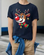 Cute Reindeer Christmas Tee with Festive Scarf and Jingle Bells - model wearing navy tee with hands in pockets