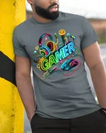 Neon Gamer Gear Graphic Tee with Headset and Mouse Art - model wearing grey tee, leaning on column