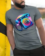 Retro 80s Phone Tee with Vibrant Neon Rotary Style Artwork - model wearing grey tee, leaning on column