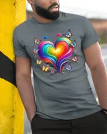Colorful Heart Butterfly Tee with Vibrant Rainbow Art Style - model wearing grey tee, leaning on column